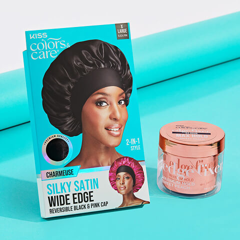 Product display of KISS Colors & Care items on a turquoise background. On the left, a boxed Charmeuse Silky Satin Wide Edge reversible bonnet in black and pink, featuring a smiling Black woman on the packaging. On the right, a small jar of edge fixer gel labeled “Maximum Hold Sweet Peach.”